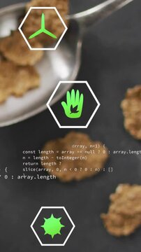 Vertical video: Shifting green hex icons over metal spoon on slate causing code highlighting flakes