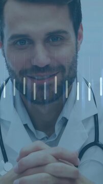 Vertical video: Pulling back Dr labcoat leaning hands clasping at clinic engaging viewer steth+ECG
