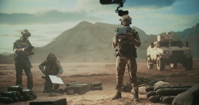 Special Forces Soldiers Coordinate a High-tech Drone Mission at a Desert Base, Operating UAV, Target Surveillance, Tactical Battlefield Strikes in Modern Warfare of Middle East Operation