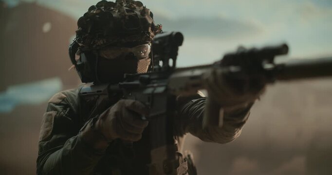 Portrait of Armed Special Forces Soldier Holding Weapon, Aiming at Enemies, Securing Zone, Fight in the Desert, Rifle Ready for Shoot and Kill, Modern Warfare Operation. Cinematic War Military Action