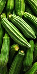 Obraz premium Vibrant Green Whole Okra Pods Arranged in a Studio Close-Up for Culinary Use and Healthy Meals