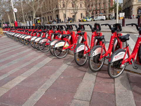 Red Bicing electric bikes at a docking station in Barcelona