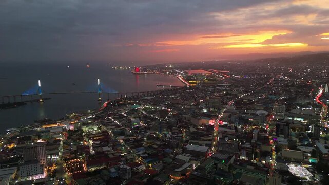 Breathtaking high-angle aerial of Cebu City skyline Philippines major metropolis during dramatic sunset