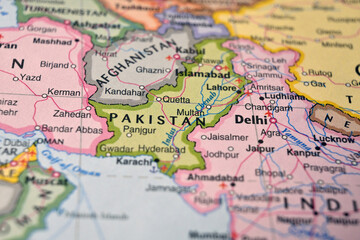 Naklejka premium Defocused World Map Background Showing Pakistan Location Top View Geography and Travel Concept