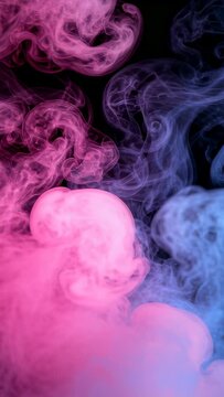 Vertical video: Vents releasing pink-blue plumes curling against black backdrop in studio for ad