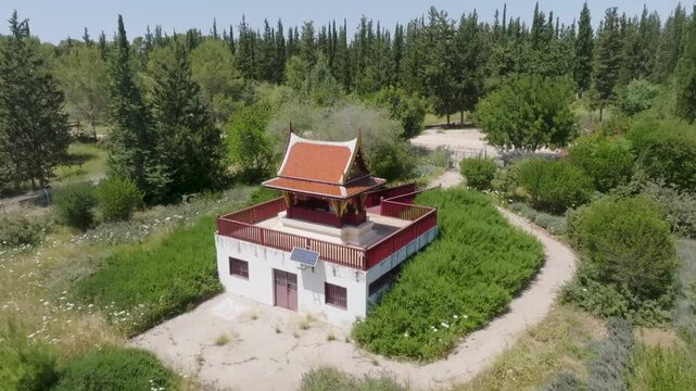 Aerial view of the Thai Pagoda in Ben Shemen Forest, Israel, surrounded by lush green pine and cypress trees