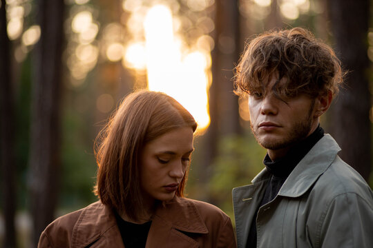 A couple in love on a date in the forest, a relationship crisis and emotional dependence