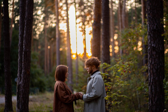 A loving couple hugging in the forest, a relationship crisis and separation
