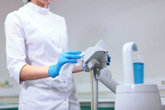 Cleaning procedure in modern dental clinic after receiving patient. Concept of cleanliness and health. Disinfection and cleaning in dental office. Patient safety in modern medical conditions.