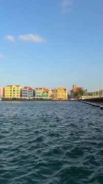 Colorful Handelskade Waterfront and Queen Emma Bridge in Willemstad, Curacao