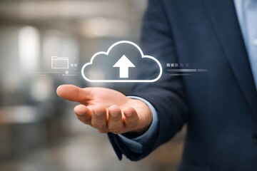 Obraz premium Hand holding cloud upload icon representing cloud computing and data storage technology