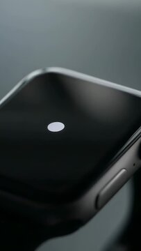 Smartwatch face in tech shoot, capturing 1s frames documenting white dot status, side button glints