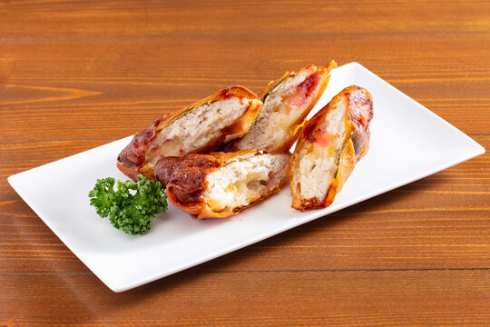 Crispy Japanese fried food platter with refreshing drinks at a cozy Izakaya, authentic pub dining experience, romantic date night with deep-fried appetizers and beer, traditional nightlife scene.