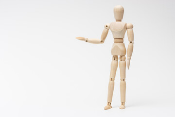 右手をあげて案内するデッサン人形