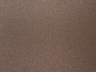 Fototapeta premium High-resolution textured bronze metallic surface with a grainy matte finish for industrial design and 3D architectural rendering.
