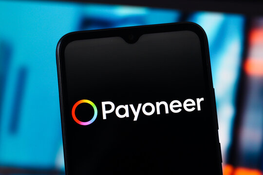 In this photo illustration, the Payoneer logo is seen displayed on a smartphone screen.