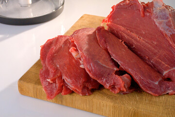 Pieces of raw red meat prepared for frying. High quality animal protein and vitamins for human body. Stock for grocery store and food industry marketing materials.