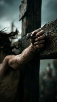 Jesus Christ's sacrifice on the cross, the agony of crucifixion at Golgotha, a powerful religious event, hand pierced by a metal nail, solemn spiritual devotion