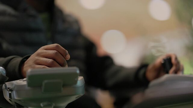Close-up of a disabled person controlling an electric wheelchair