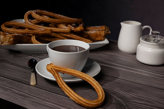 Rustic still life of churros and hot chocolate