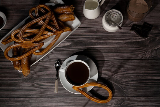 Traditional Spanish sweet churros with chocolate cup