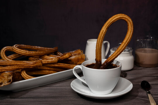 Spanish churros dessert served with hot chocolate drink