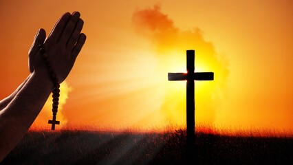 Obraz premium Concept of praying with wooden rosary beads