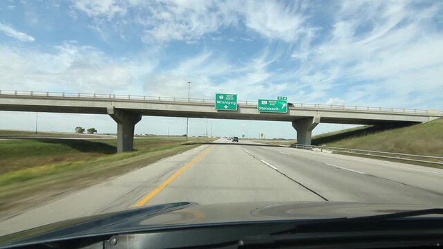 Manitoba bridges with signs for Winnipeg and Steinback. HD.