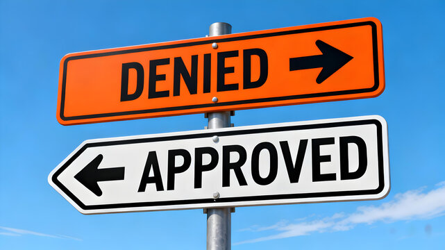 Decision making crossroads with approved and denied signs pointing opposite directions