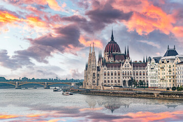 The Hungarian Parliament Building in Budapest situated along the banks of the Danube River under a...