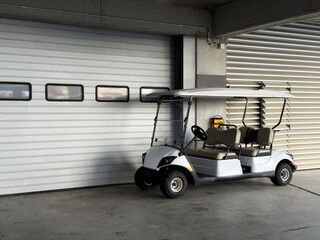 Mini storage facility with rows of units and a golf cart with handicap sign © Angelov