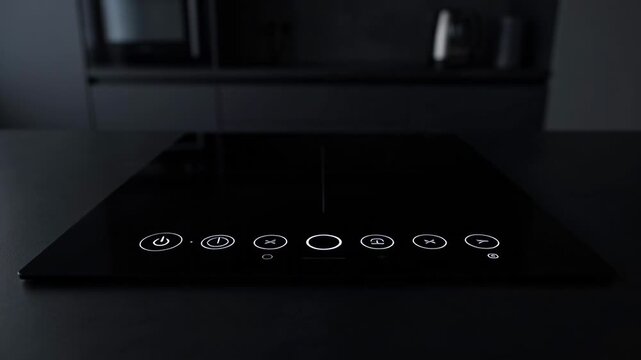 ?Modern induction cooktop: activated buttons and features in action