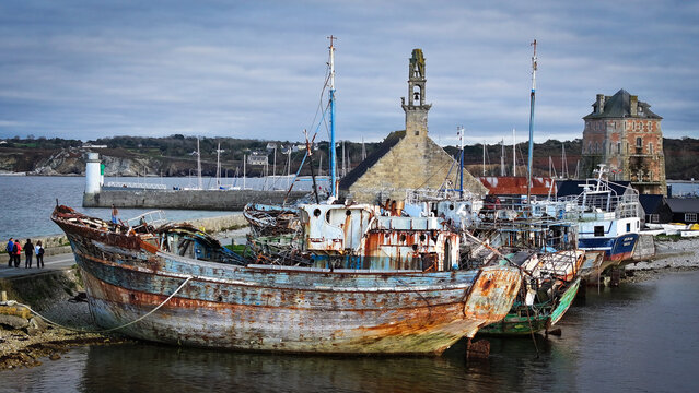 Aerial view of weathered boats nestled near the Vauban Tower and Notre Dame de Rocamadour chapel, showcasing the town's rich maritime history, Camaret-sur-Mer, Bretagne, France.