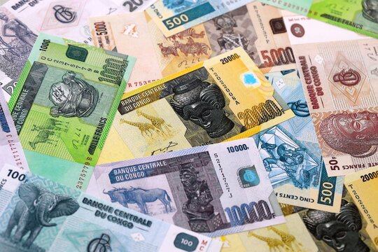 CFA franc money bills pile on table. Republic of the Congo banknotes of XAF currency close up.