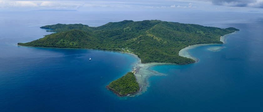The beautiful island of Makogai in Fiji is fringed by a healthy coral reef. Fiji's reefs support high marine biodiversity and are a popular destination for scuba divers and snorkelers.