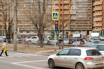Cars are parked at a controlled pedestrian crossing. © Vectorina