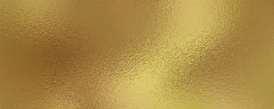 Gold metallic effect foil. Golden texture for design. Beautiful background. Abstract glitter mottled speckled structure.