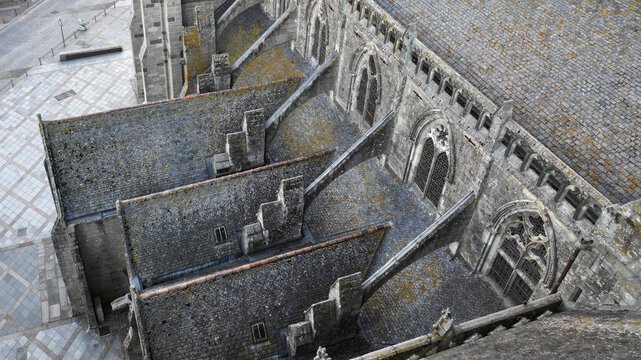 Aerial view of the weathered stone roof and gothic architecture of the Cathedral, revealing intricate details and textures, Saint-Pol-de-Leon, Brittany, France.