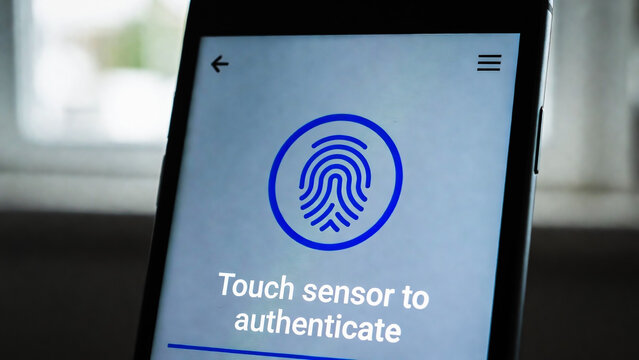 A smartphone displays a touch sensor authentication screen with a blue fingerprint icon. It prompts the user to authenticate.
