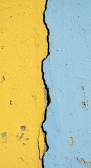 Obraz premium Cracked Yellow and Blue Wall Texture with Paint Peeling Effect