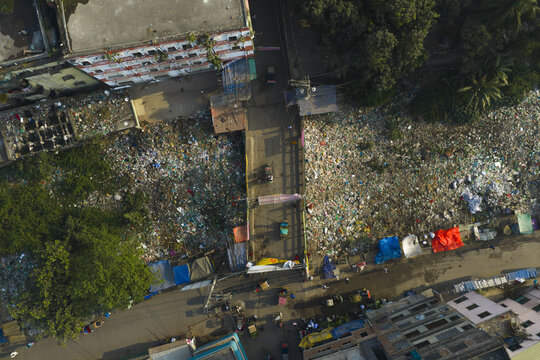 Aerial view of a river clogged with refuse, reflecting the harsh reality of pollution amidst the urban landscape, Dhaka, Dhaka Division, Bangladesh.