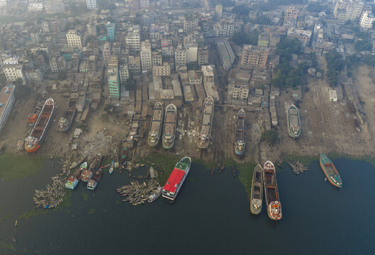 Aerial view of ships docked along the Buriganga River, creating a mosaic of textures against the backdrop of the urban landscape, Dhaka, Dhaka Division, Bangladesh.