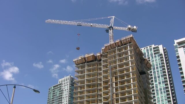 Construction crane building condominium. Toronto, Canada circa 2008. HDV footage. HD