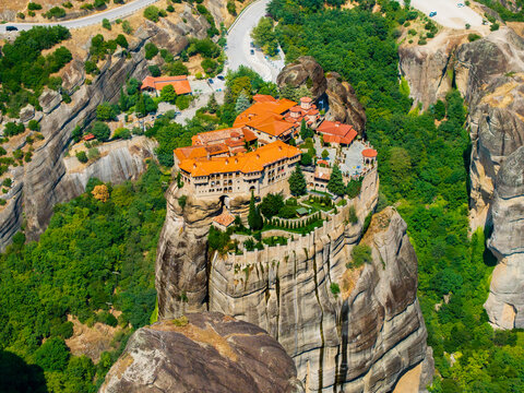Aerial view of the monasteries perched atop towering rock formations, a blend of human architecture and nature's grandeur, Meteores, Trikala, Greece.