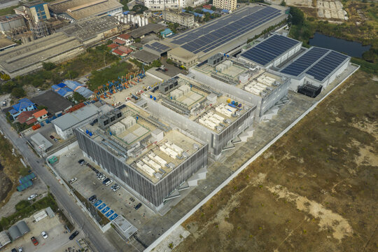 Aerial view of modern ai data center campus creating a network and connecting resources with extensive solar panel installations in bang sao thong, thailand