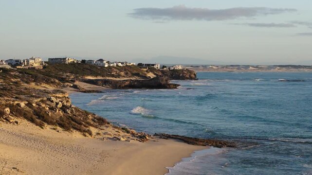 4k 60p footage of the Iconic Arniston coastline with its turquoise waters and beautiful village homes in the background. Serene remote beach in Overberg, Western Cape, South Africa.