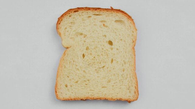 Close-up of fresh and appetizing sliced bread, perfect for a delicious breakfast. Fresh, fluffy, and irresistible sliced bread in a close-up that whets the appetite.