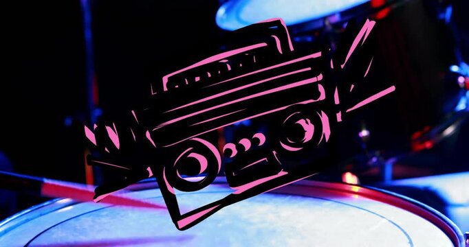 Boombox illustration appearing on lit snare head and rotating down drum shell, for music designers
