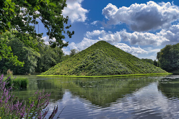 Land Pyramid and Snake Lake Bridge in Branitzer Park, historic English landscape garden in Cottbus, Brandenburg, Germany
