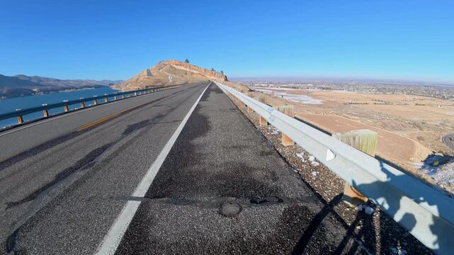 Immersive POV from winter biking on the Centennial Road along Horsetooth Reservoir in Colorado foothills near Fort Collins